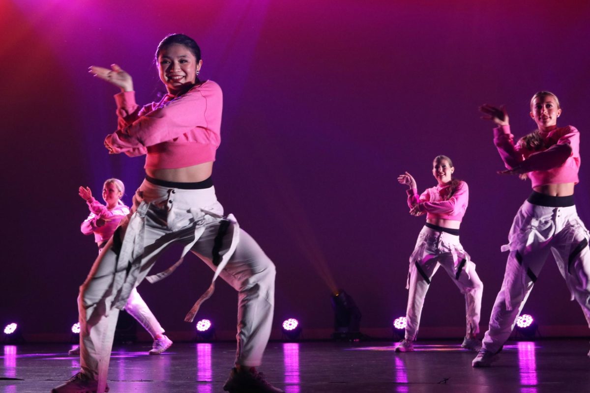 Tran performs during a hip-hop dance. Before this, the colorguard performed a second time to “Can’t Catch Me Now.”