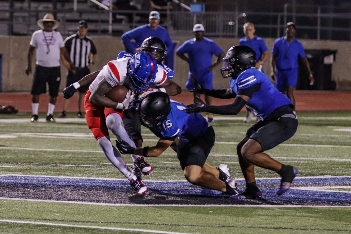 Safety Eli Mitchell makes a hit on a Duncanville receiver, resulting in a fumble toward the end of the teams scrimmage on Aug. 22. The Hawks followed up the scrimmage with a  48-31 victory against Dallas Jesuit last Friday.  