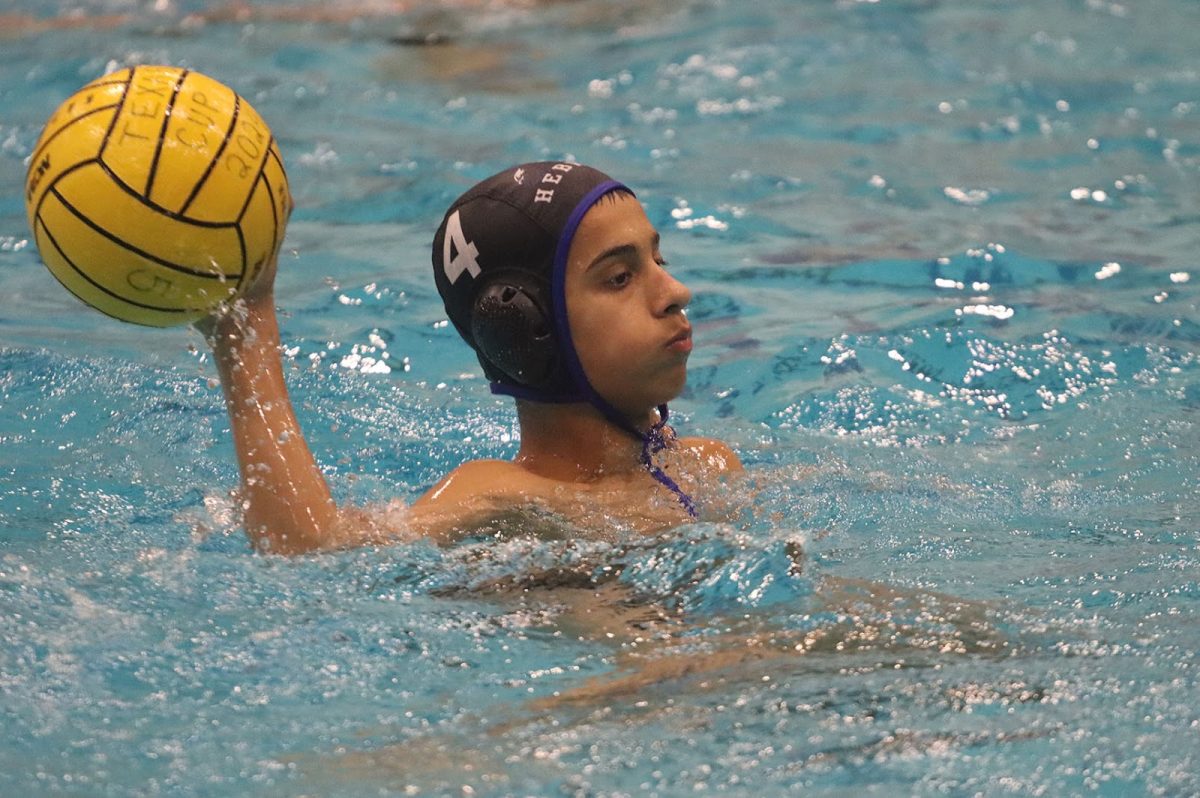 Attacker Kamren Carruso catches the ball and waits for an opportunity to pass it during the team’s game against Prosper on Aug. 30. Caruso scored one goal on three shot attempts as the Hawks went on to win 20-11. 