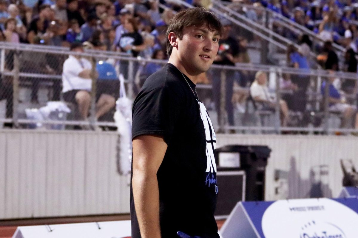 Defensive end Clay Lindmark looks away after hyping up the crowd during the Homecoming game against Marcus on Oct. 4. Lindmark was out for the game, and the team won 31-6.