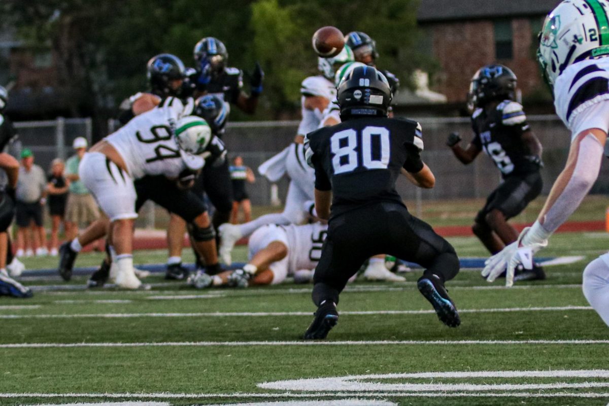 Nathan prepares to catch a pass after he beats his defender on a comeback route during the team’s home opener against Southlake Carroll. Nathan started in his first ever varsity game against Southlake Carroll as the slot receiver.