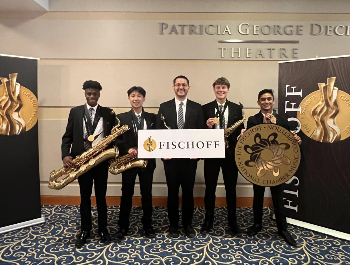 Luke poses with the Plexus Saxophone Quartet, a quartet he performed with. The quartet performed at the Fischoff Competition at the University of Notre Dame last summer.