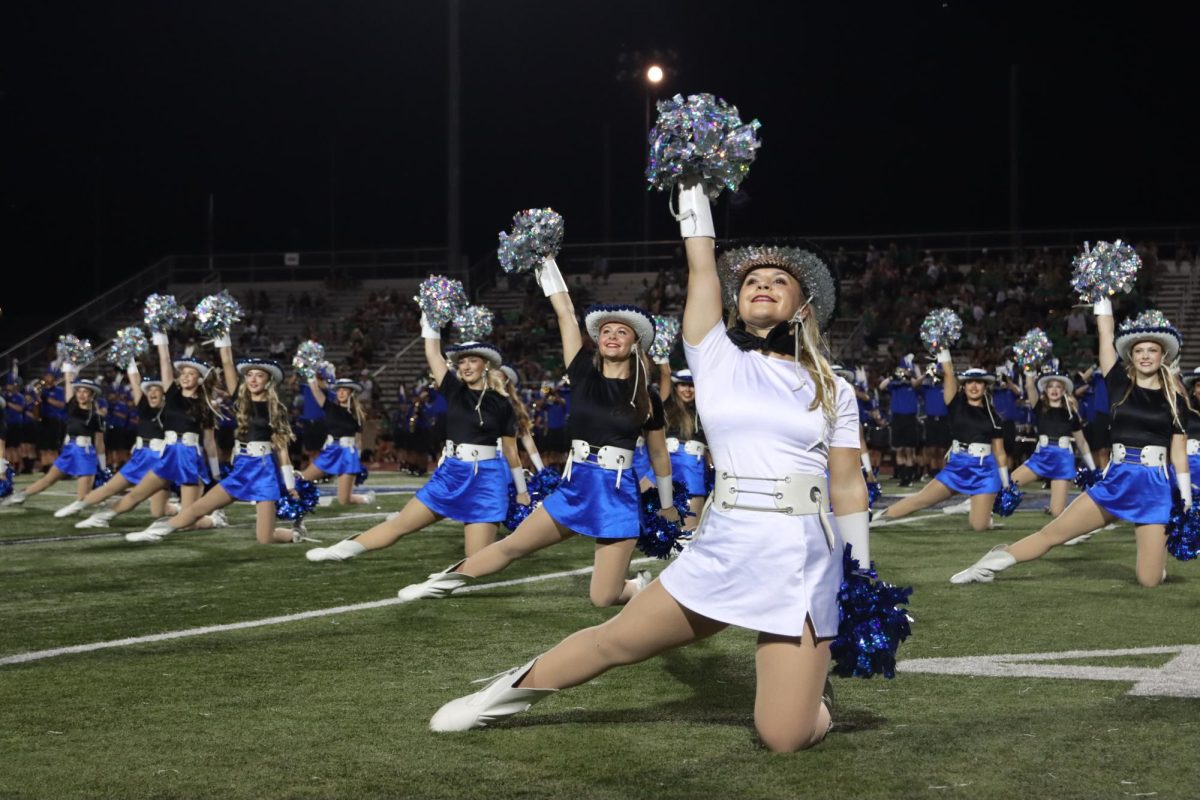 Junior lieutenant Ryann Phillips performs with the Silver Wings during halftime on Sept. 9. This was the football team’s first home game, where they lost 59-16.