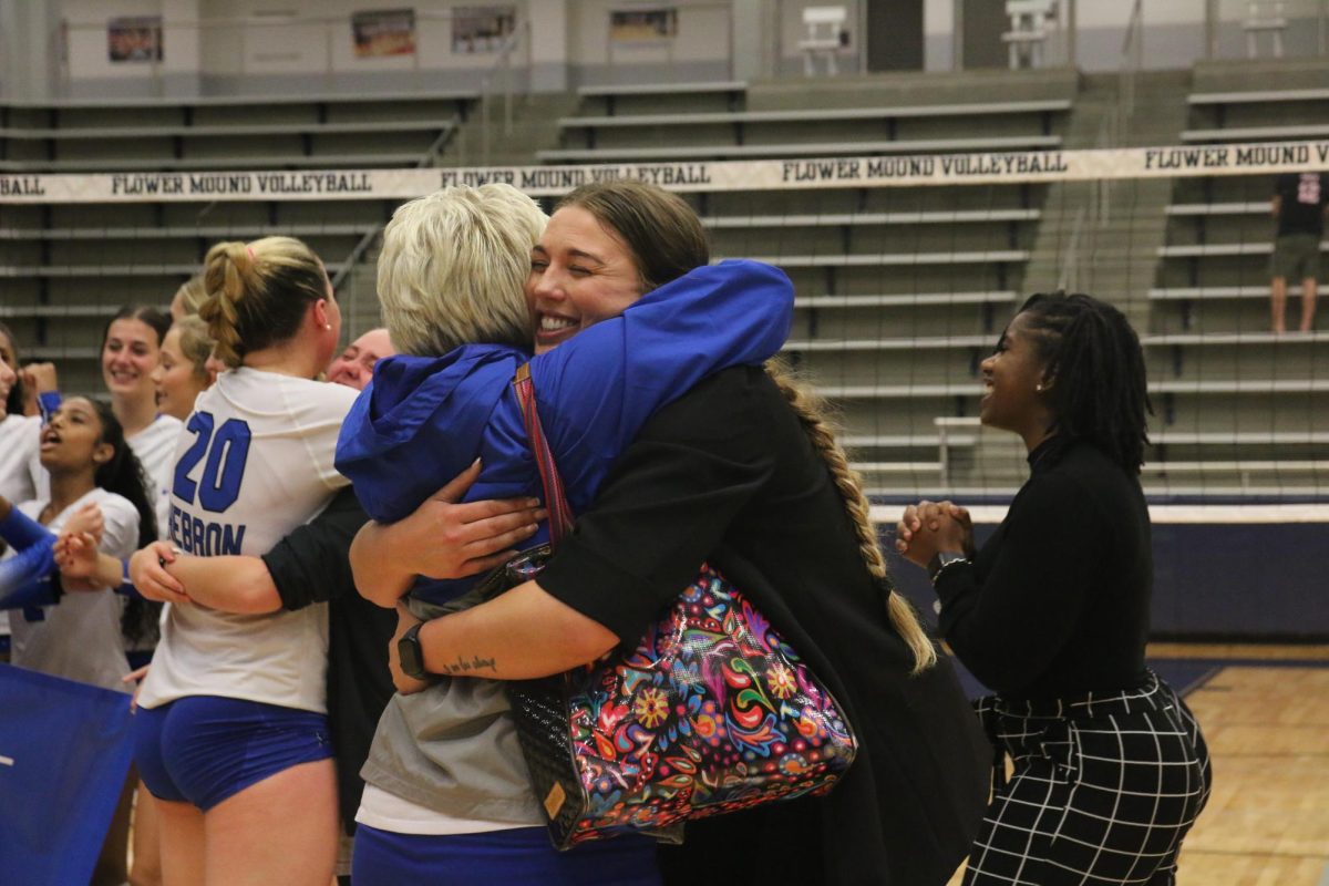 Head coach Rachel Buckley hugs principal Dr. Amy Boughton after the game. The Lady Hawks will now prepare for the playoffs, and Buckley said they still have work to do. “I could not be more confident with this team with how they’re gelling, and how they’re playing,” Buckley said. “[But] I think there’s still more to get.”