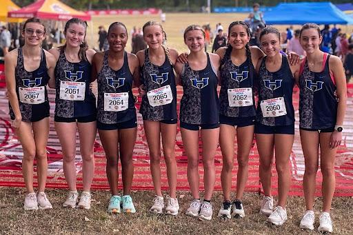 The cross country girls pose before their run at the Arkansas Chile Pepper Festival on Sept. 28. They placed 23 out of 75. 