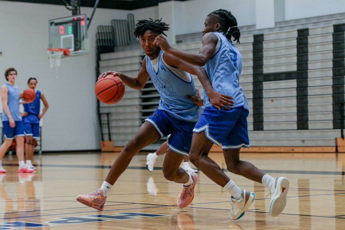  Guard Parker Bolden drives toward the rim against guard J’yln Jenkins during a practice on Nov. 7. The team will play its season opener against Lone Star High School on Nov. 8. 