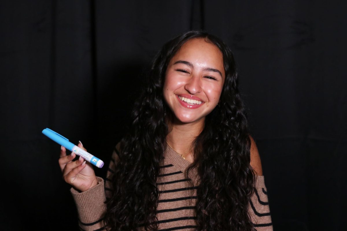 Sophomore Maddie Pruitt holds her insulin pen that she uses daily. People with Type 1 diabetes have to inject insulin four to five times a day in order to keep their blood sugar at a healthy level.