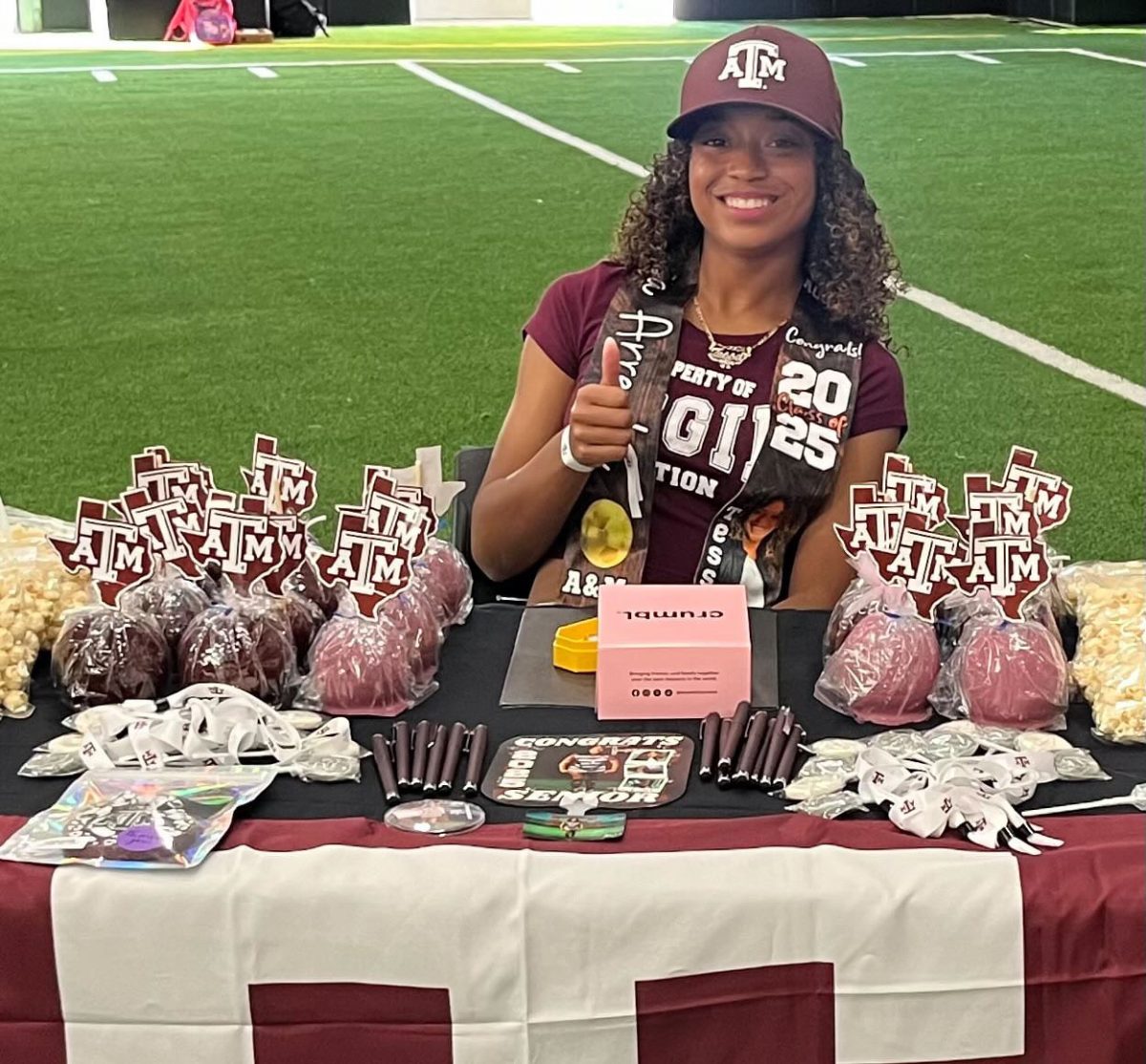 Soccer player Tessa Arreola does the “Gig ‘Em” hand sign on signing day on Nov. 13. She officially signed with Texas A&M after her verbal commitment on Aug. 22, 2023. (Photo provided by Tessa Arreola)