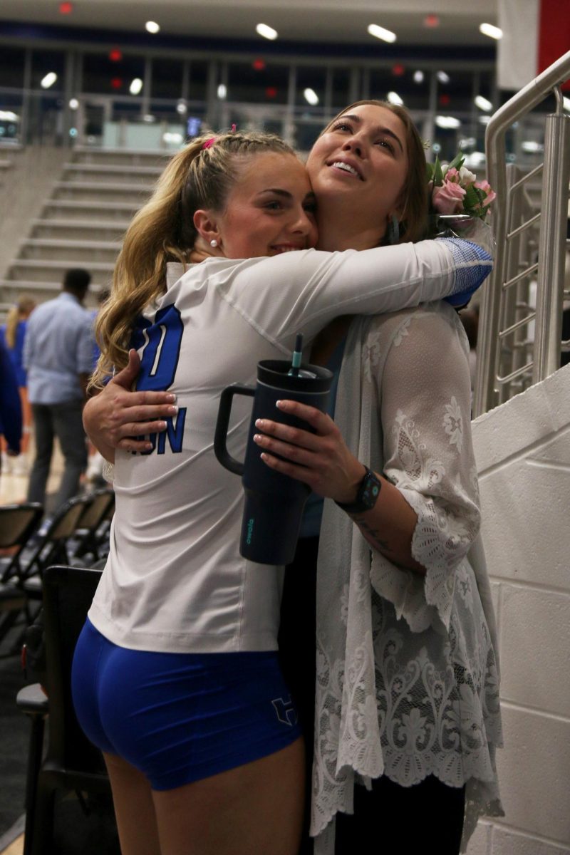 Vary hugs Buckley at the senior night game on Oct. 18. Vary has known Buckley for two years after meeting her at the volleyball summer camps her junior year of high school. “After our first district game, my mom [had to] take my dad to the hospital,” Vary said. “Right in my mind, I knew there’s only one person to call. I had to call [Buckley]. She calmed me down [because] she’s so good about reminding me that [I] can’t control the uncontrollable. She’s always one call away.” 