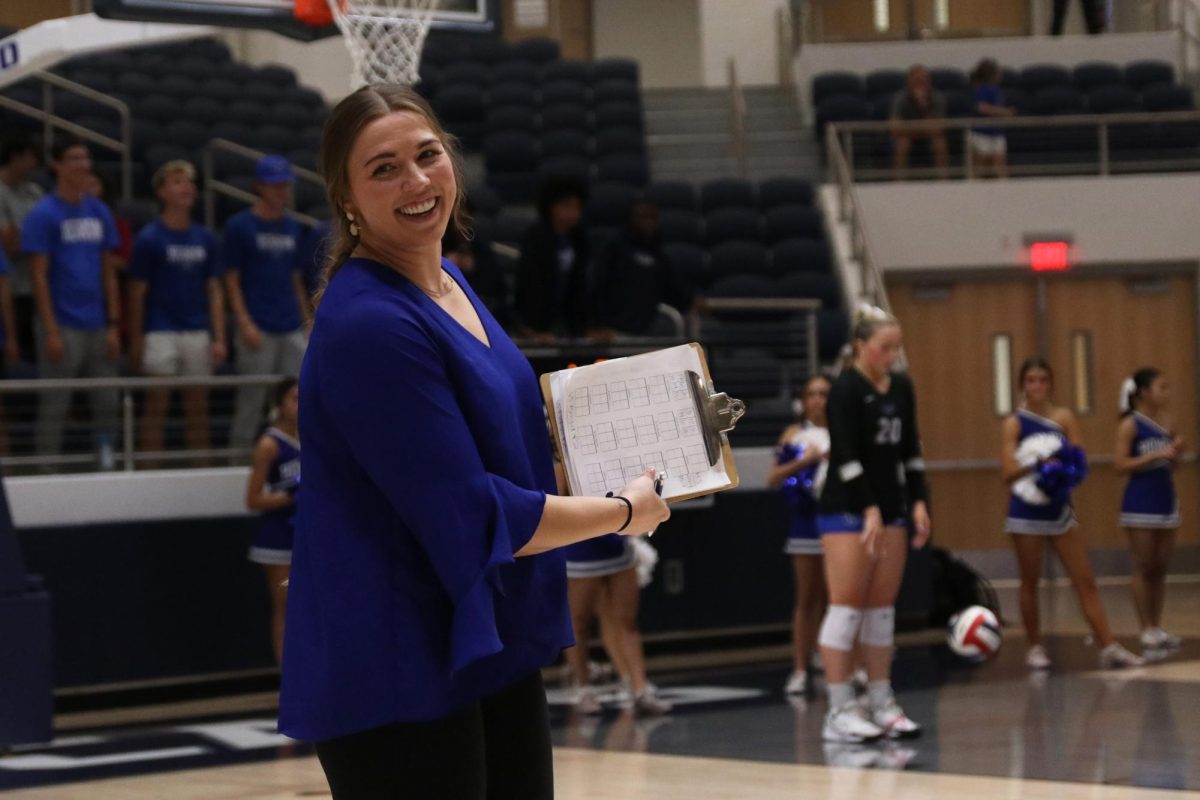 Head coach Rachel Buckley looks back at the bench as she motions a play to outside hitter Addison Vary during the first round of playoffs against Mckinney Boyd on Nov. 4. In Buckley’s first year as head coach, the Lady Hawks made it to round three of the playoffs with an undefeated district record before losing 3-0 to Southlake Carroll on Nov. 12.