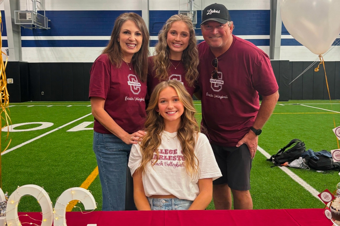 Volleyball player Jordan Patrick sits with her family surrounding her on signing day on Nov. 13. She officially signed with the University of Charleston after her verbal commitment on Sept. 12, 2023. (Photo provided by Jordan Patrick)