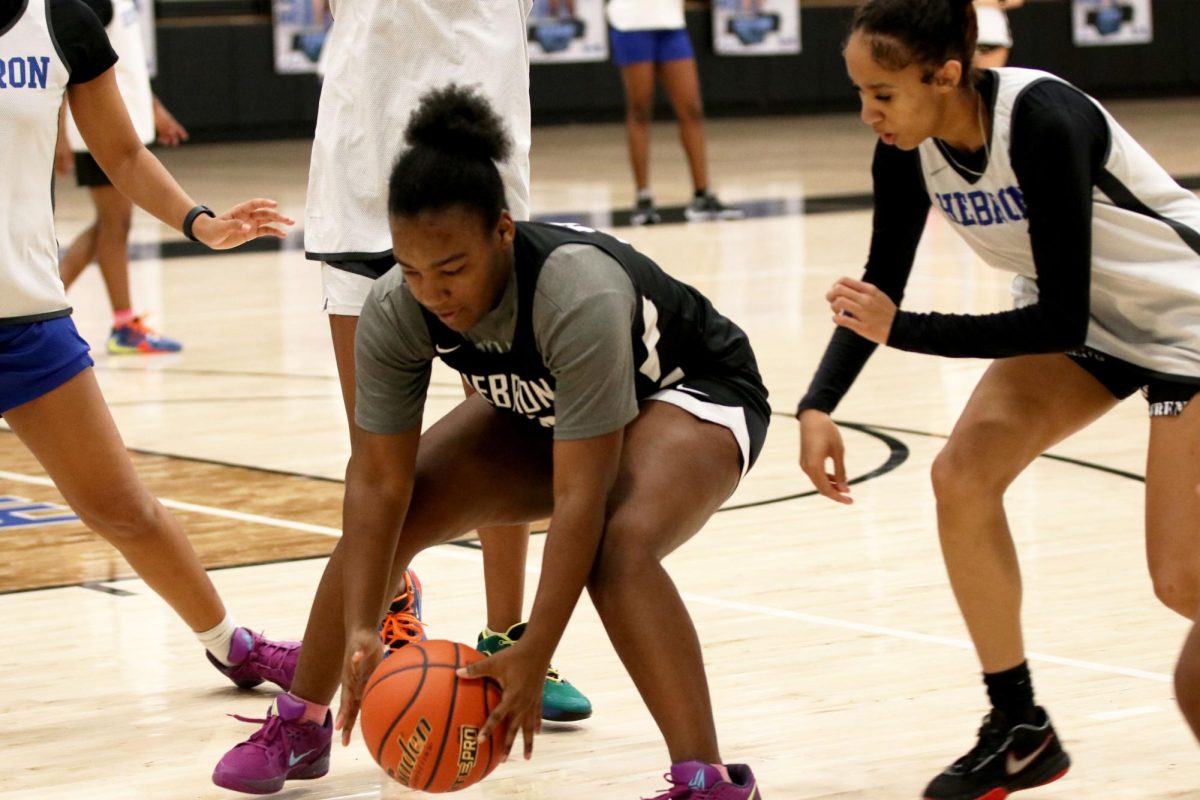 Small forward Monet Brown goes through a practice drill on Dec. 6 in preparation for their upcoming games. The Lady Hawks are going into their second district game against Marcus with an overall record of 7-7.