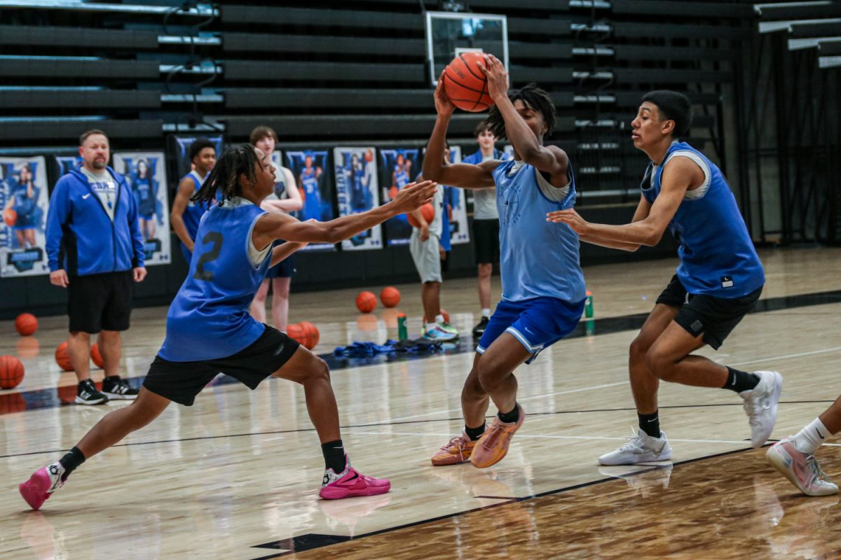 Guard Parker Bolden drives through two defenders during a practice on Jan. 16. The team will play a district matchup at Marcus Jan. 17.