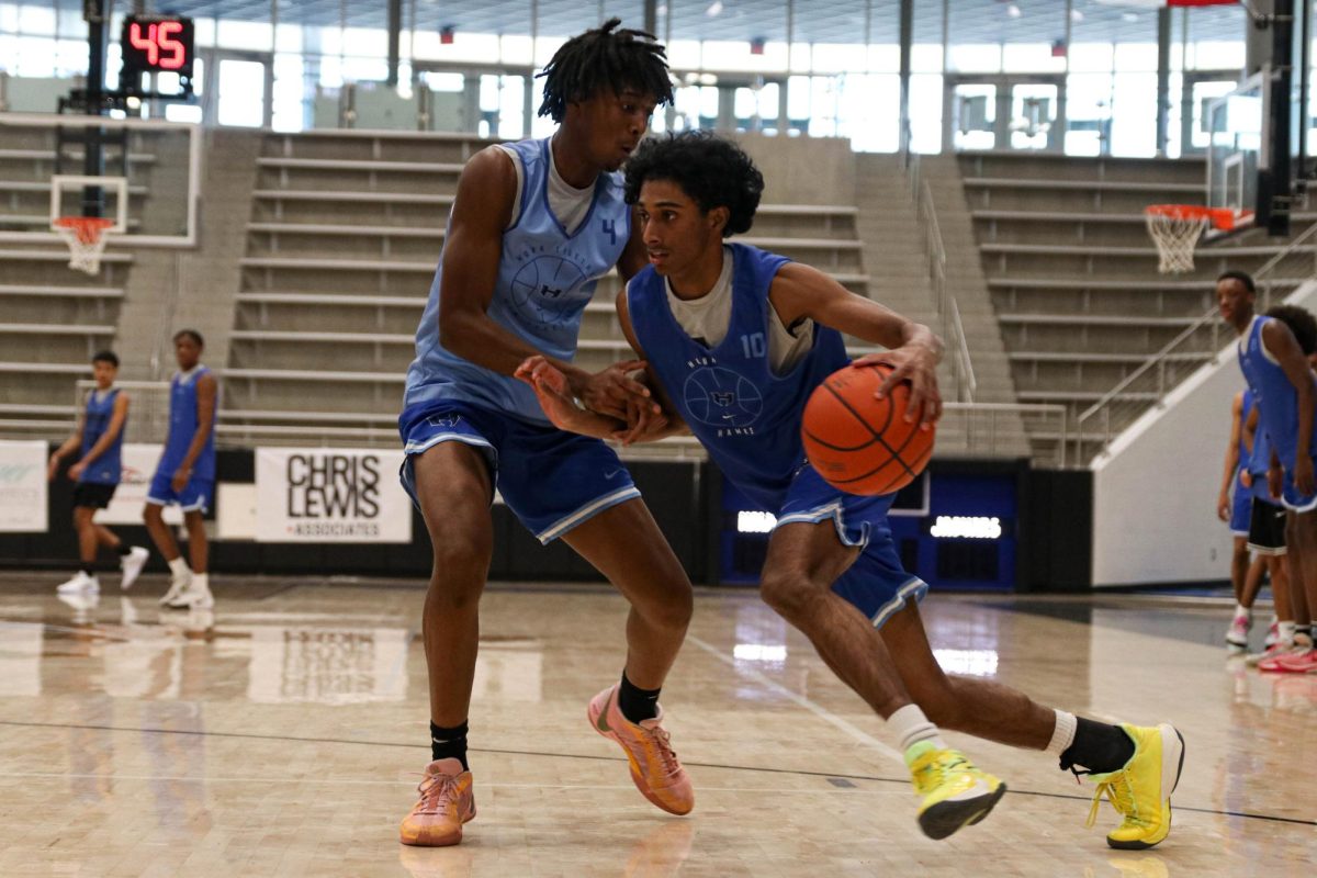 Guard Nirav Perumal drives past guard Parker Bolden during a practice on Jan. 16. The team will play a district matchup against Little Elm on Jan. 24.